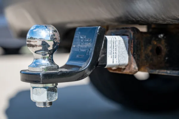 closeup of adjustable ball mount towing hitch installed on pickup truck