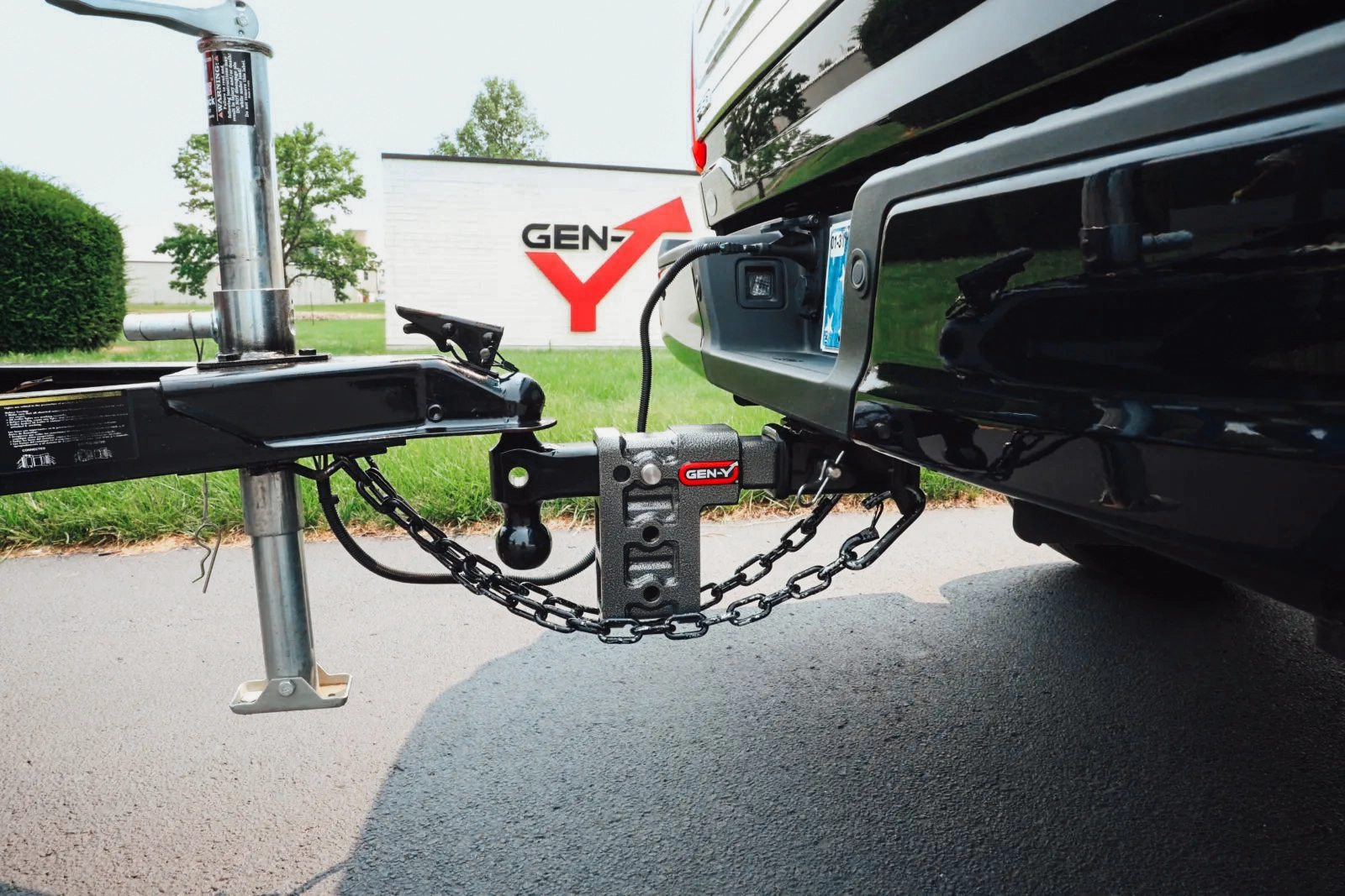 A Gen Y adjustable drop hitch attached to a truck