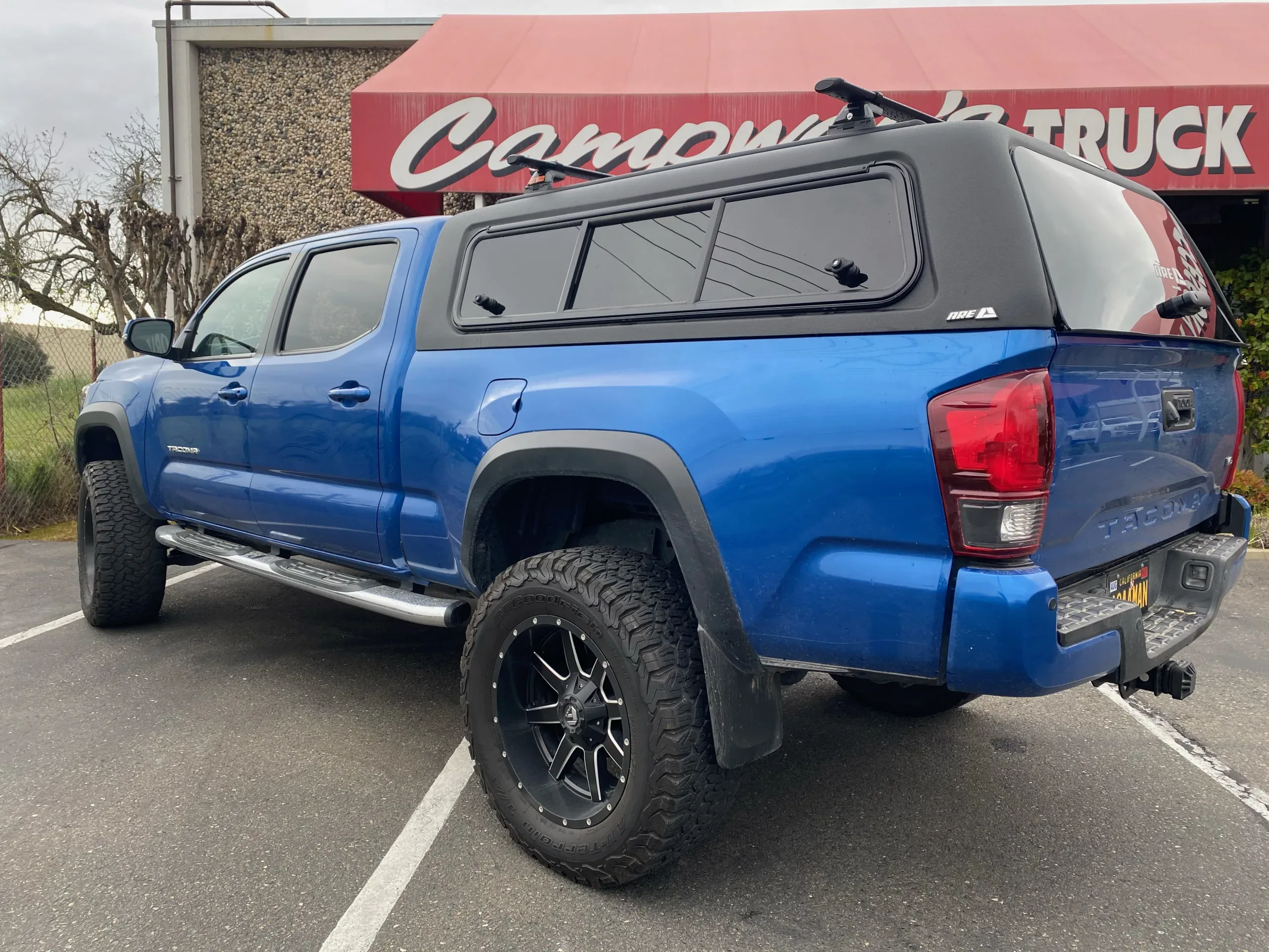 A.R.E. truck cap installed on toyota tacoma truck bed