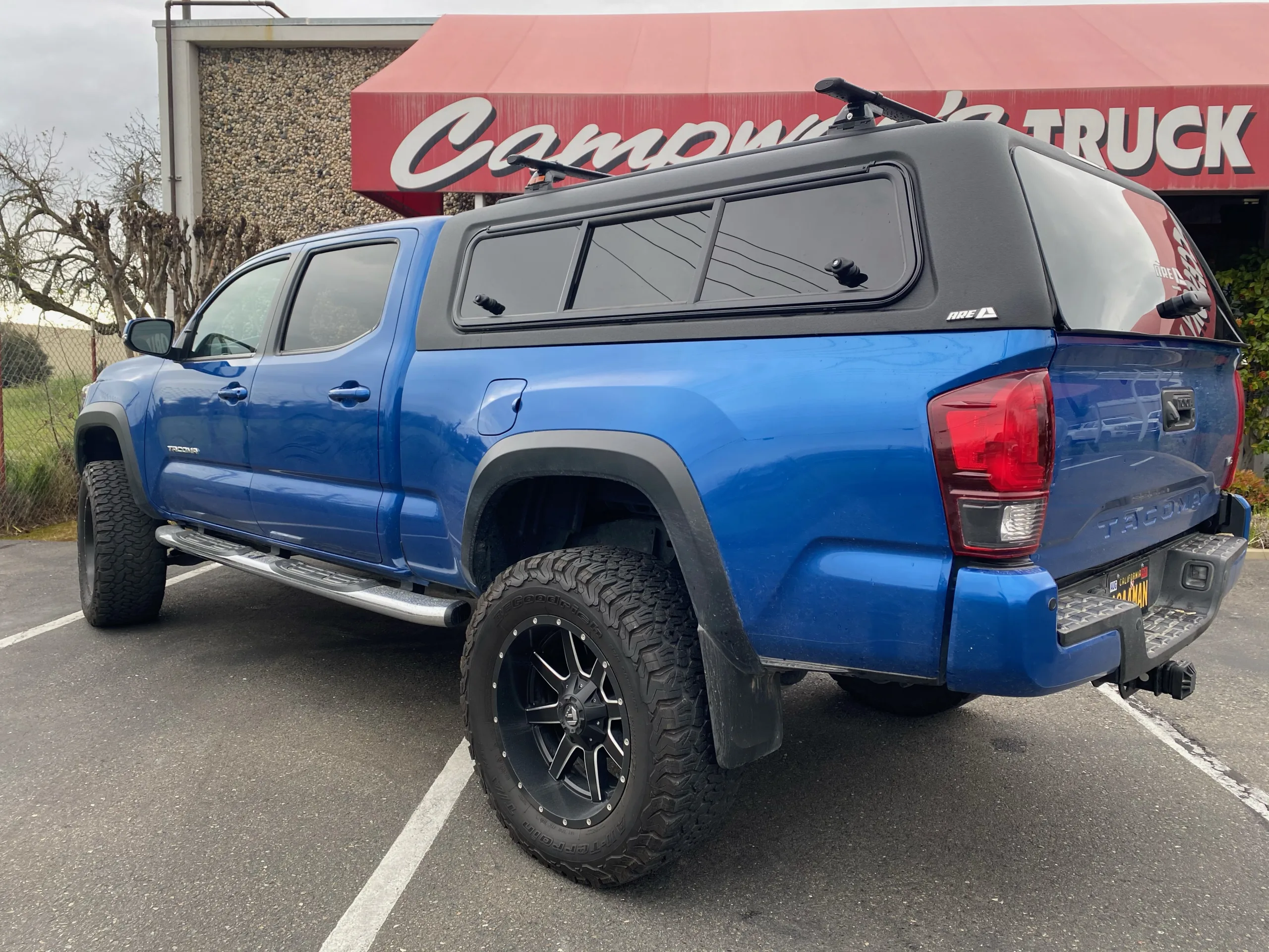 A.R.E. truck cap installed on toyota tacoma truck bed
