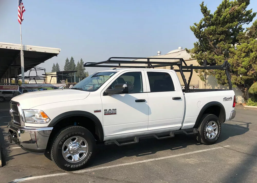 A Rack It HD truck rack, or a lumber rack, on a white pickup truck