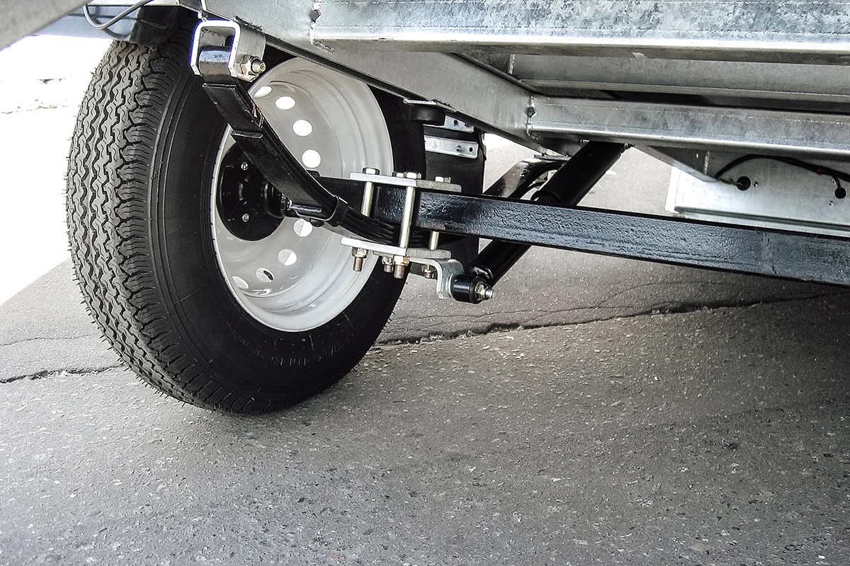 Close-up of trailer suspension and axle