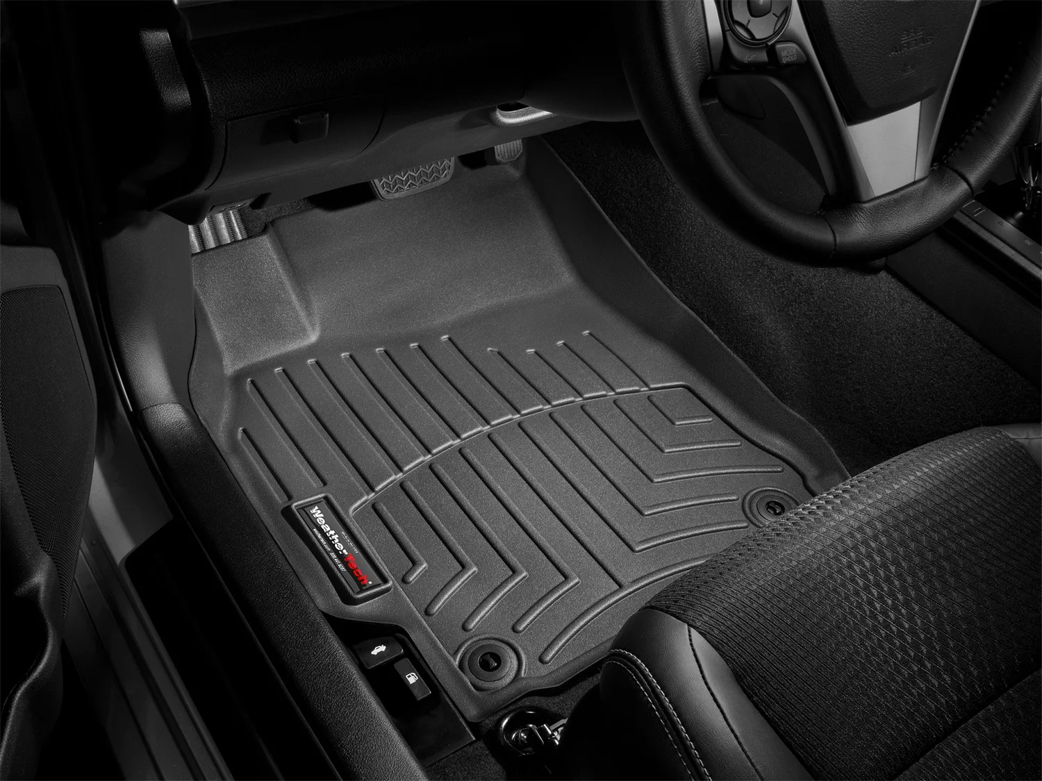 A weathertech truck floor liner in black